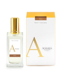 Room and linen spray bottle next to its packaging, labeled "Agraria Balsam.