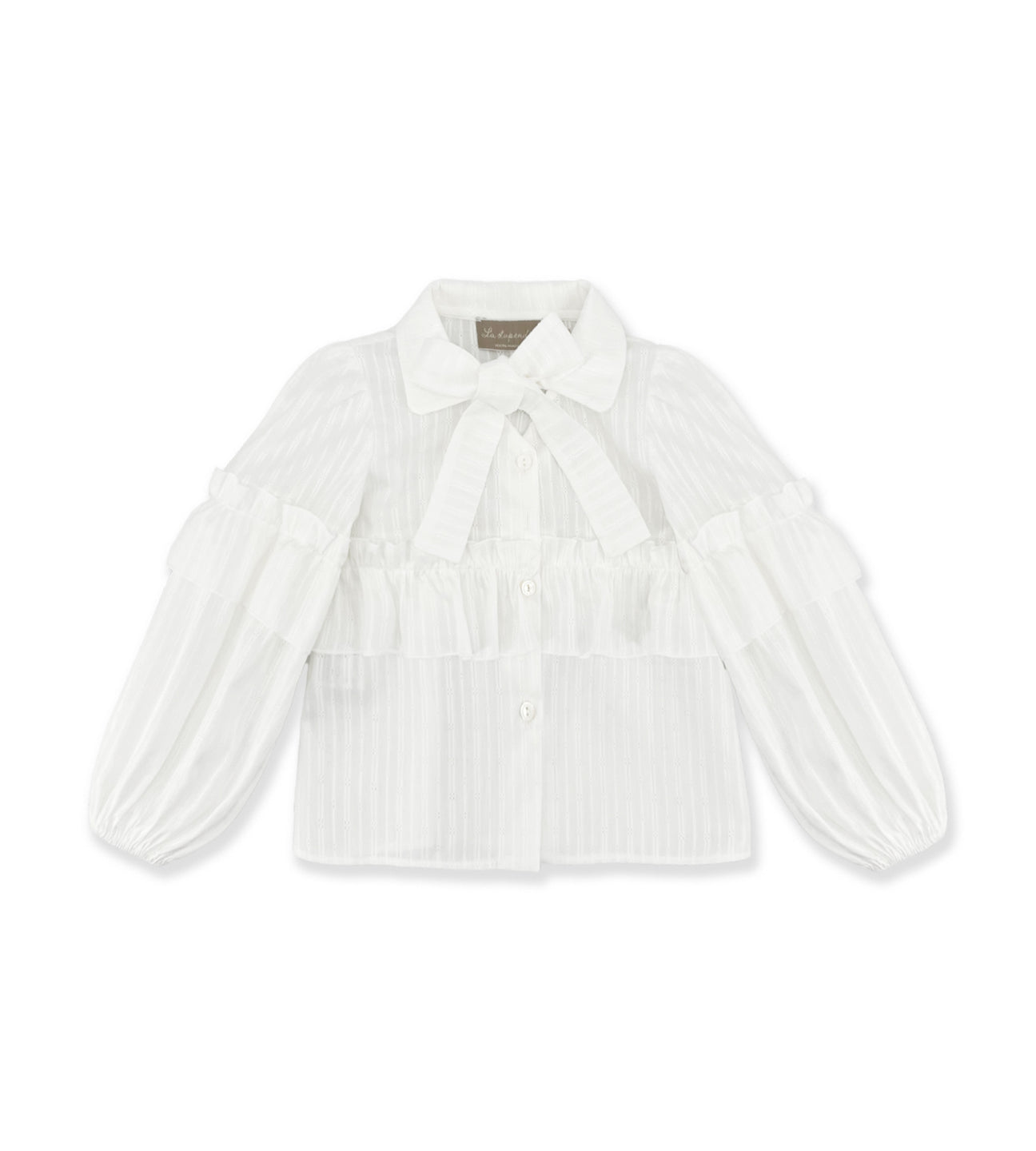508231D8-B76A-4487-B637-3034C424A8C9_1296x White blouse with a bow tie, ruffled layers, and puffed sleeves.
