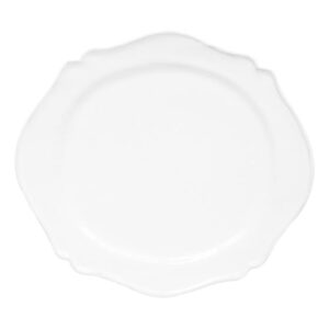 Large white dinner plate with a scalloped edge, empty and centered.