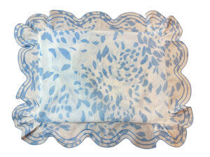 Blue and white boudoir sham with a floral pattern and ruffled edges.