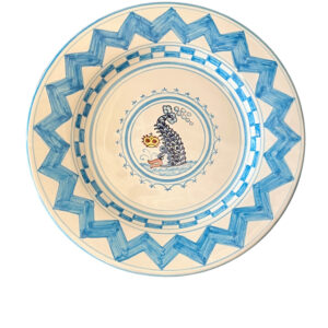 Ceramic plate featuring a blue wave design and a fish illustration in the center.