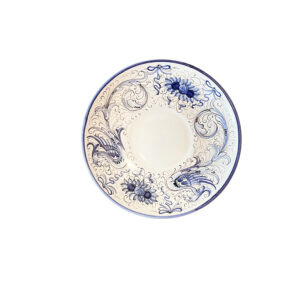 Blue and white saucer with floral designs and a central circular area.