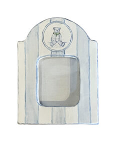 Small picture frame with blue stripes and a teddy bear illustration at the top.
