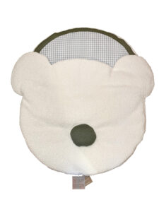 White sleeping bag shaped like a bear's face, featuring a green nose and a blue checkered interior.