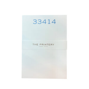 A folded card with the number "33414" and "THE PRINTERY" printed on it.