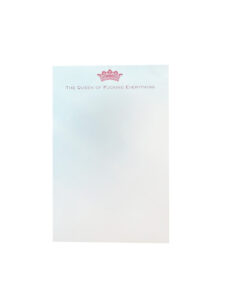 A notepad with the text "The Queen of Fucking Everything" and a pink crown graphic at the top.