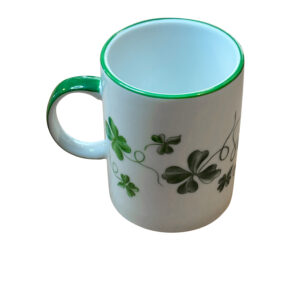 Clover green mug with a white body, featuring green clover designs and a matching rim.