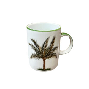 White mug with a palm tree design and green rim.