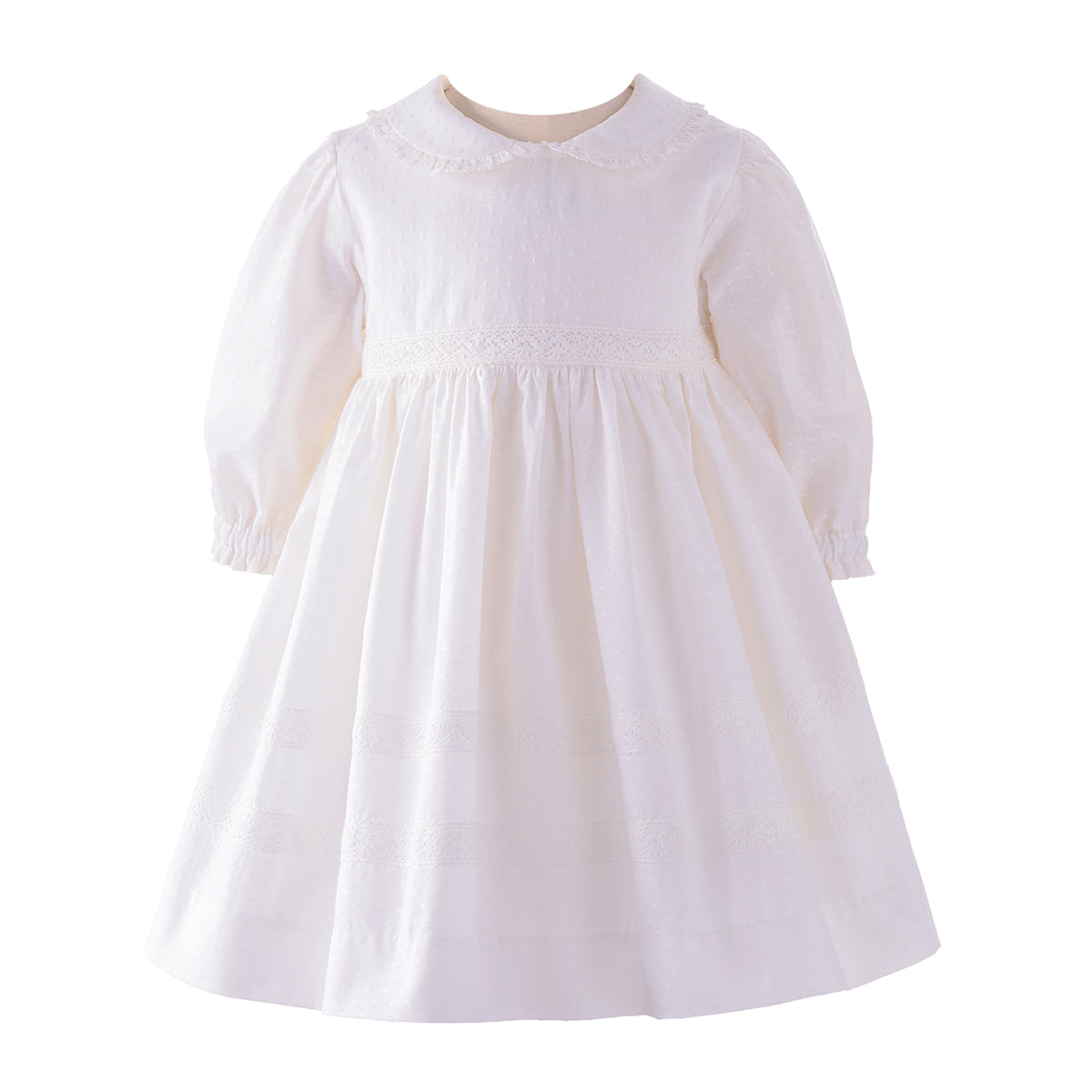 White dress with long sleeves and a collar, featuring delicate lace and textured fabric.