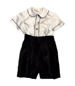 Silk short-sleeve shirt with collar and black velvet shorts, styled as a boys' outfit.