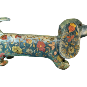 A decorative silk velvet dachshund with colorful floral embroidery.