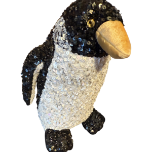 A large, sequined penguin plush with a golden beak and shiny black and white body.