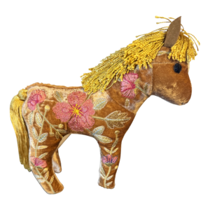 A plush horse toy with golden mane and embroidered flowers on a velvet body.