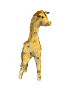 A yellow giraffe figurine with floral patterns stands upright, showcasing intricate detailing.