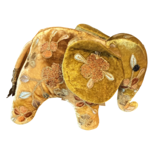 Miniature yellow silk elephant with floral embroidery and a decorative tail.