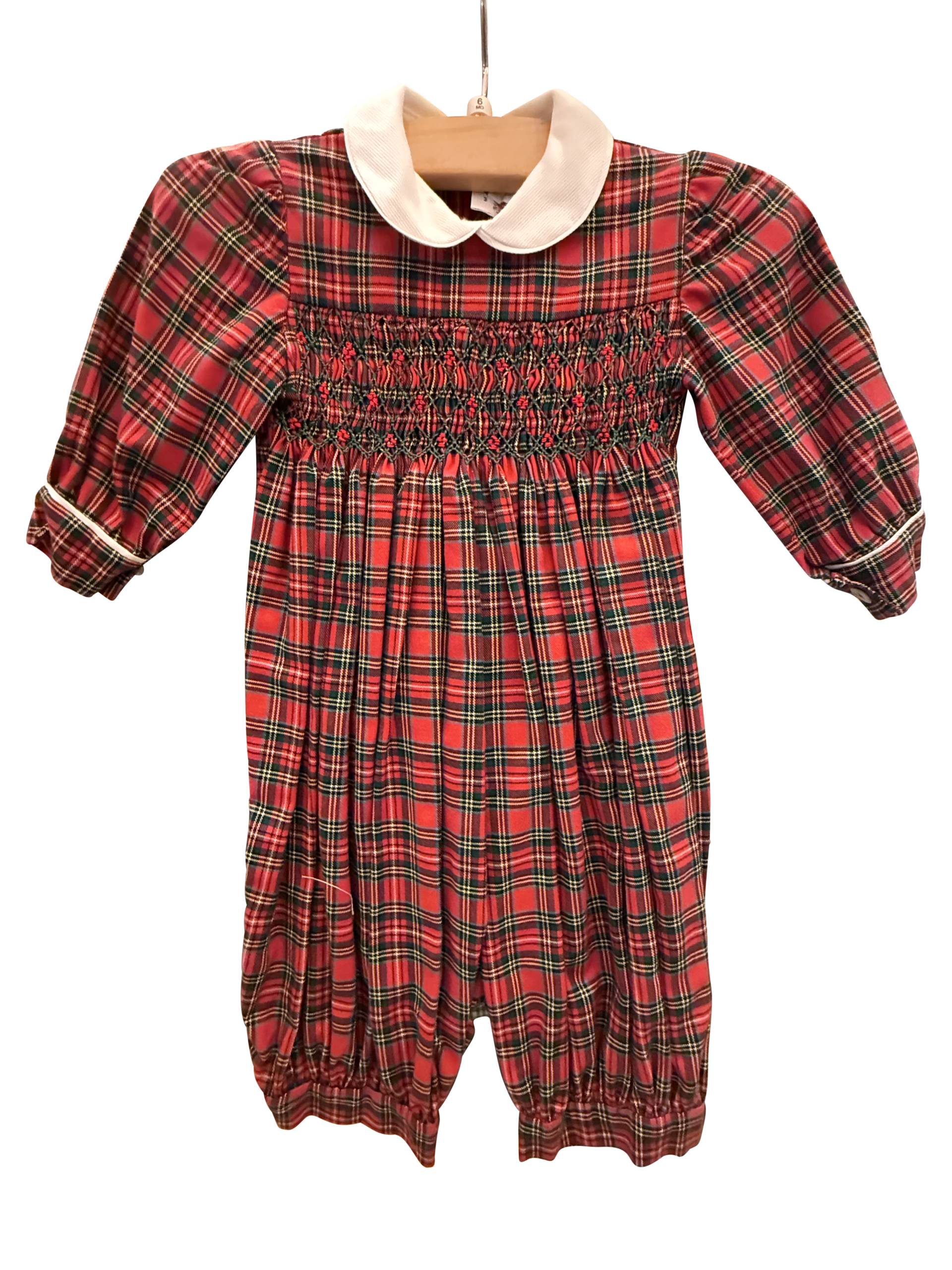 Baroni Tartan Long Romper Red tartan long romper with a white collar and smocked bodice, hanging on a wooden hanger.