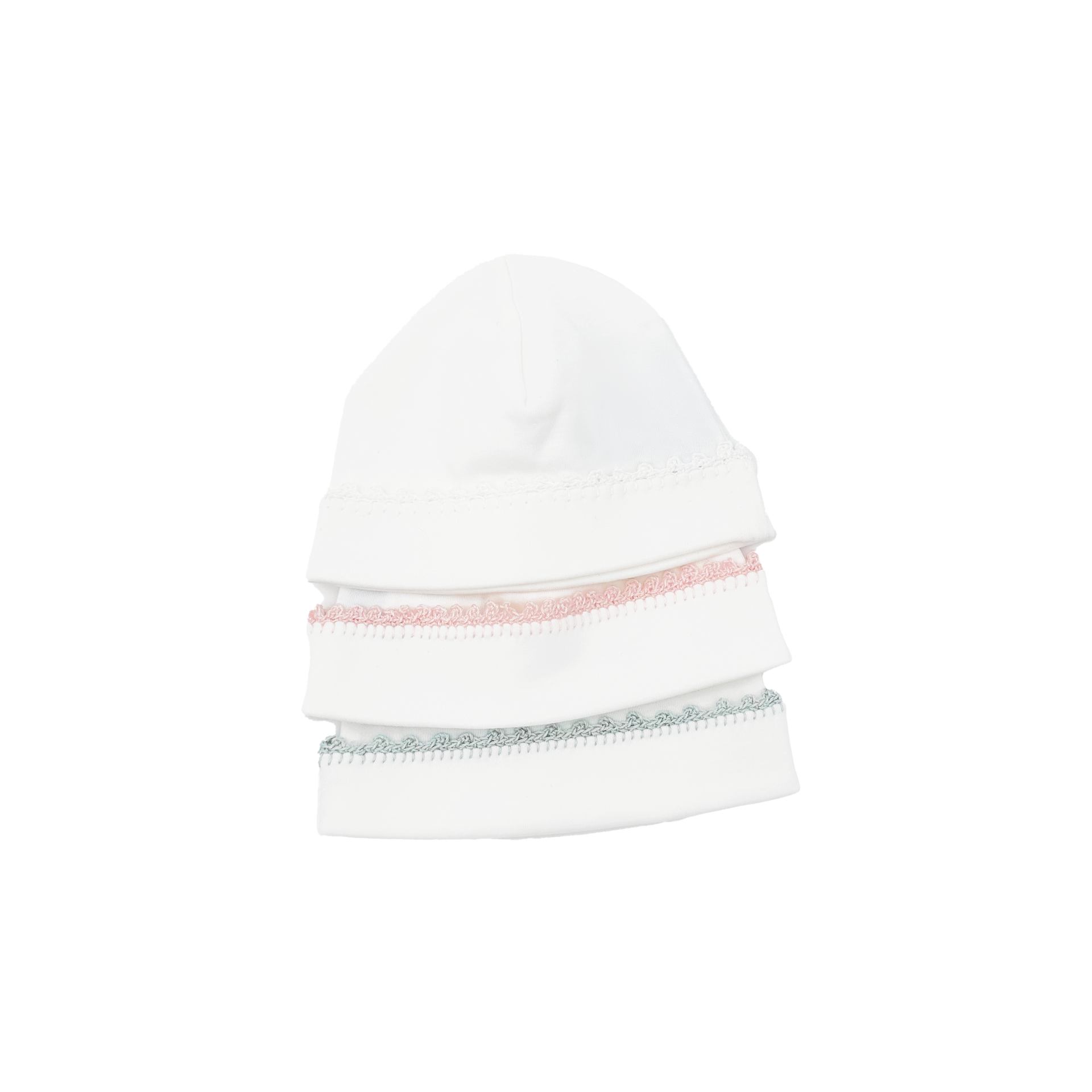 Three stacked white caps with pink and green decorative bands.