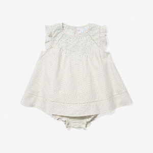 Light-colored baby dress with floral pattern and ruffled sleeves, paired with matching bloomers.