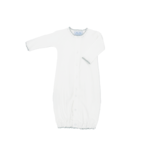 White baby gown with long sleeves and decorative trim, featuring a button closure.