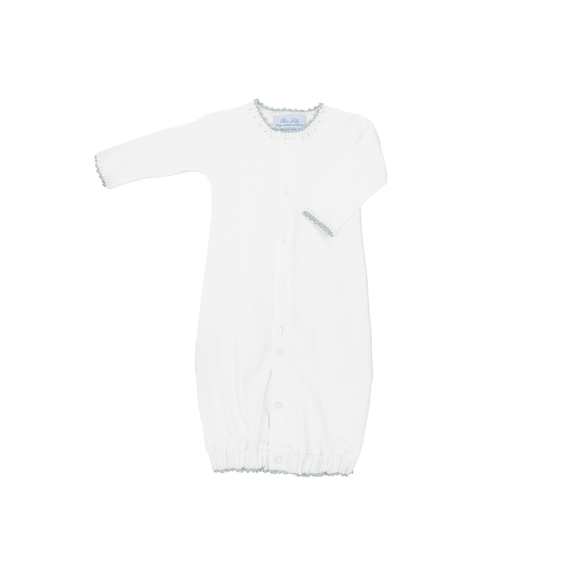 White baby gown with long sleeves and decorative trim, featuring a button closure.