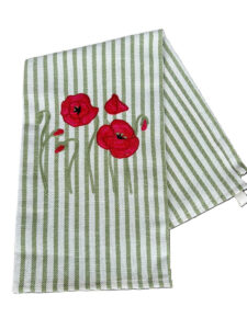 Striped green and white fabric with red poppy flower embroidery.