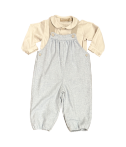 Beige long-sleeve shirt with a collar paired with gray wool overalls.