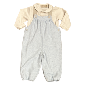 Beige long-sleeve shirt with a collar paired with gray wool overalls.