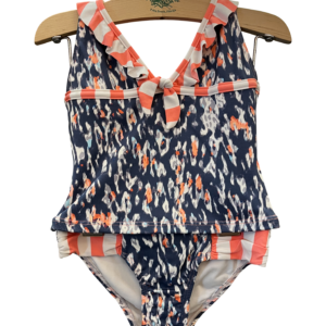 Two-piece swimsuit featuring a navy and coral pattern with ruffled straps and a tied front.