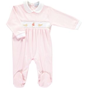 Light pink baby romper with a white collar and embroidered designs on the chest.