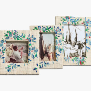 Three decorative photo frames display fishing memories, featuring people with fishing rods and large catches.