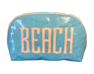 Turquoise zippered bag with "BEACH" printed in bold, striped letters.