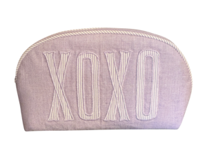 Lavender round zip pouch with "XOXO" embroidered on the front.