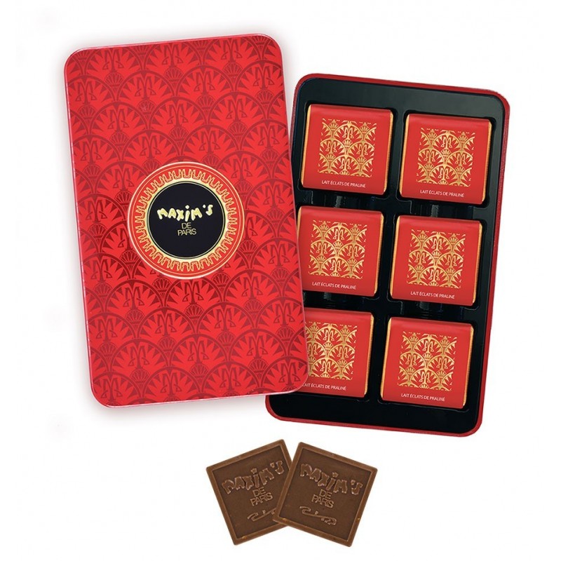 Red tin with gold design contains milk chocolate praline squares, two squares placed outside the tin.