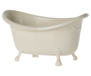 A small, vintage-style bathtub with curved edges and claw feet.