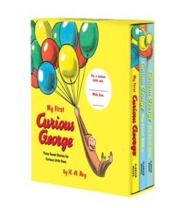 A colorful book set featuring Curious George holding balloons, titled "My First Curious George.