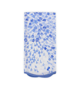 A folded fabric featuring a floral pattern in various shades of blue on a white background.
