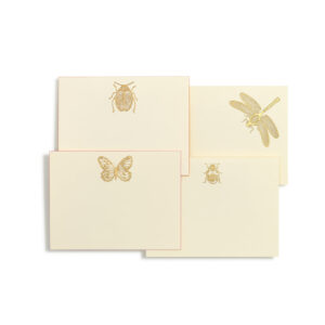 Four cream-colored notecards feature gold-embossed insect designs: a beetle, butterfly, dragonfly, and ladybug.