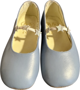 Pale blue girls' shoes with star-shaped embellishments on a strap.