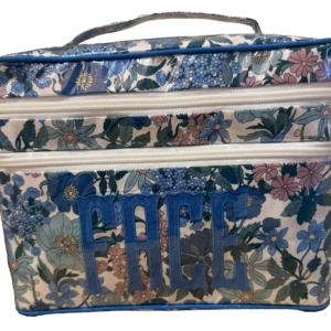 Floral-patterned bag with blue "FACE" lettering on the front and two zippered compartments.