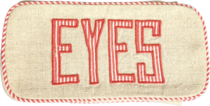 Red and white striped glasses case with "EYES" embroidered in bold letters.