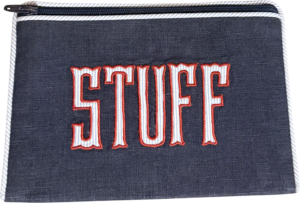 Navy blue flat zip pouch with red "STUFF" text on the front.