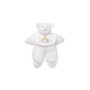 White teddy bear wearing a bib with embroidered rabbits and a sun design.