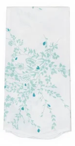 White fabric with light blue floral and leaf patterns, folded neatly.