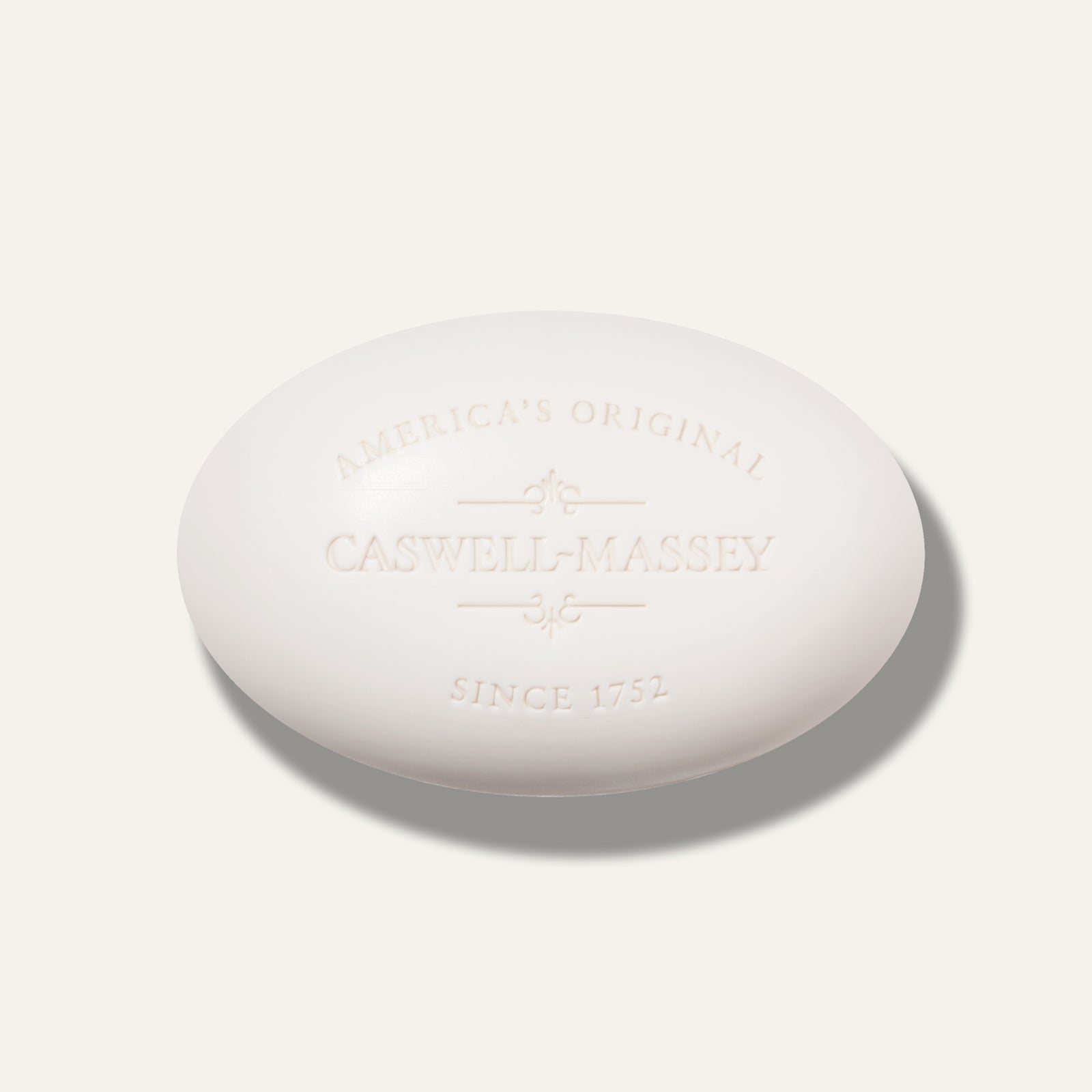 White oval soap with embossed text "Caswell-Massey" and "America's Original Since 1752.