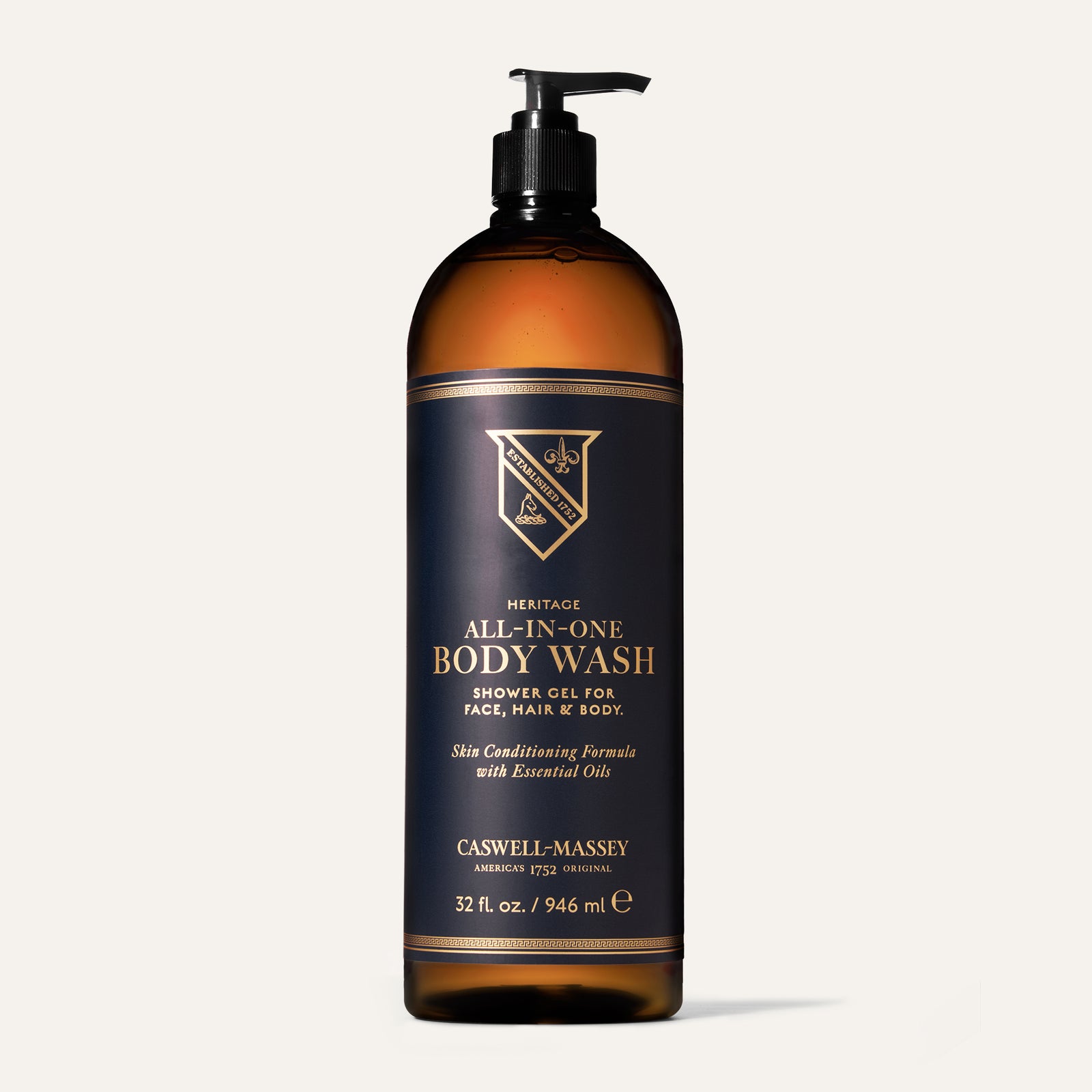 Brown bottle of Caswell-Massey Heritage All-in-One Body Wash with pump, labeled for face, hair, and body use.