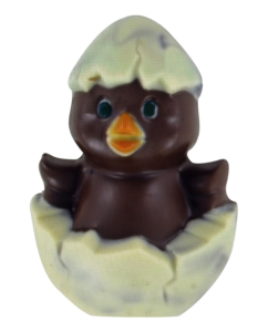 Chocolate duck emerging from a cracked egg, with a light-colored top and dark body.