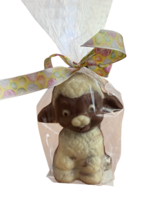 Chocolate lamb figurine wrapped in clear plastic with a colorful ribbon.