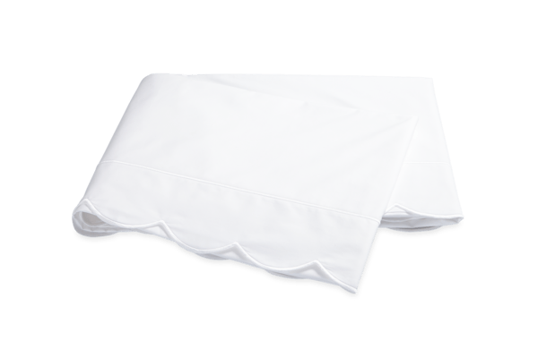 White tablecloth with a scalloped edge, neatly folded.