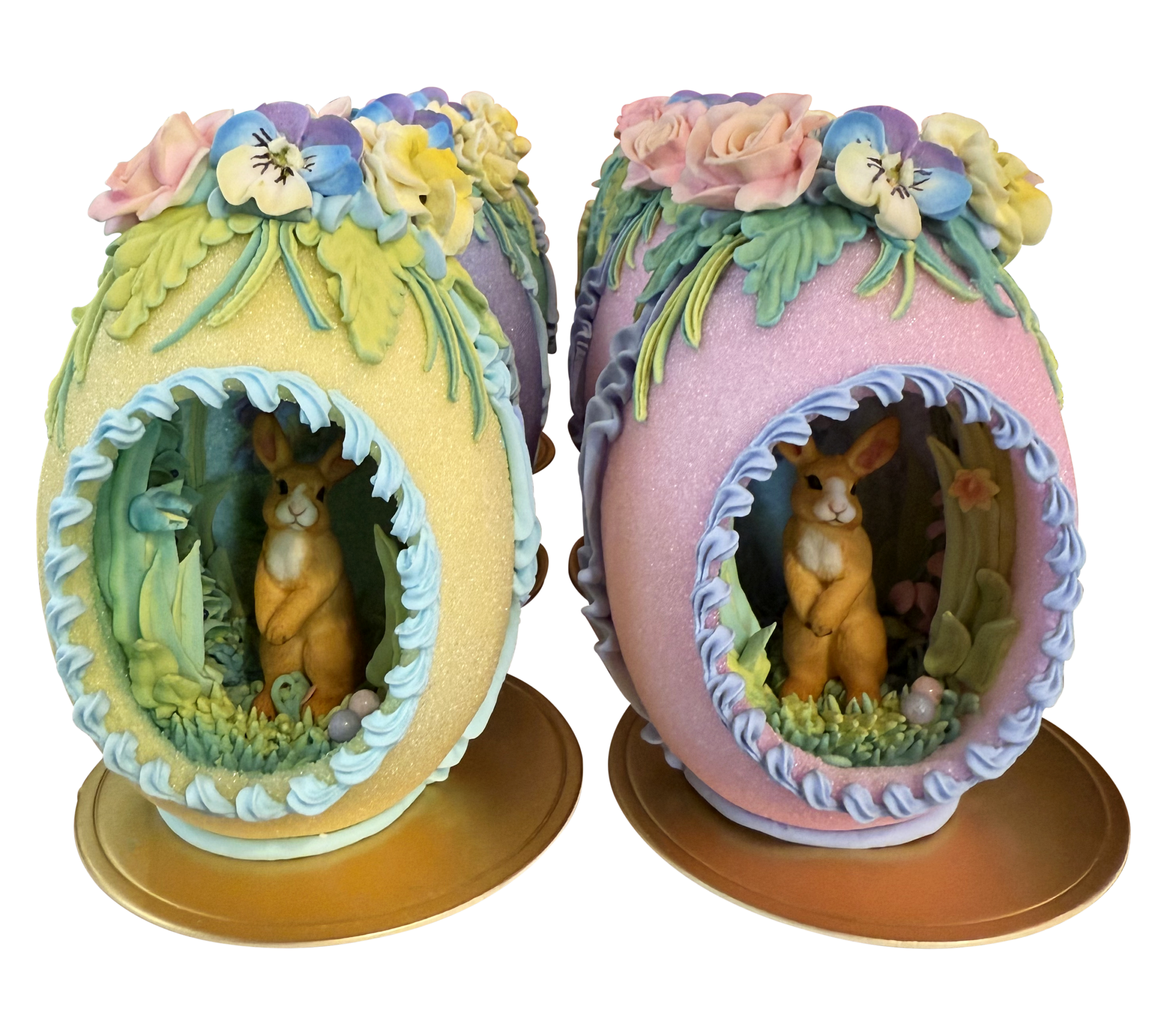 ISugar Egg Medium Bunny Upright Two decorative sugar eggs with bunnies inside, adorned with flowers and greenery.