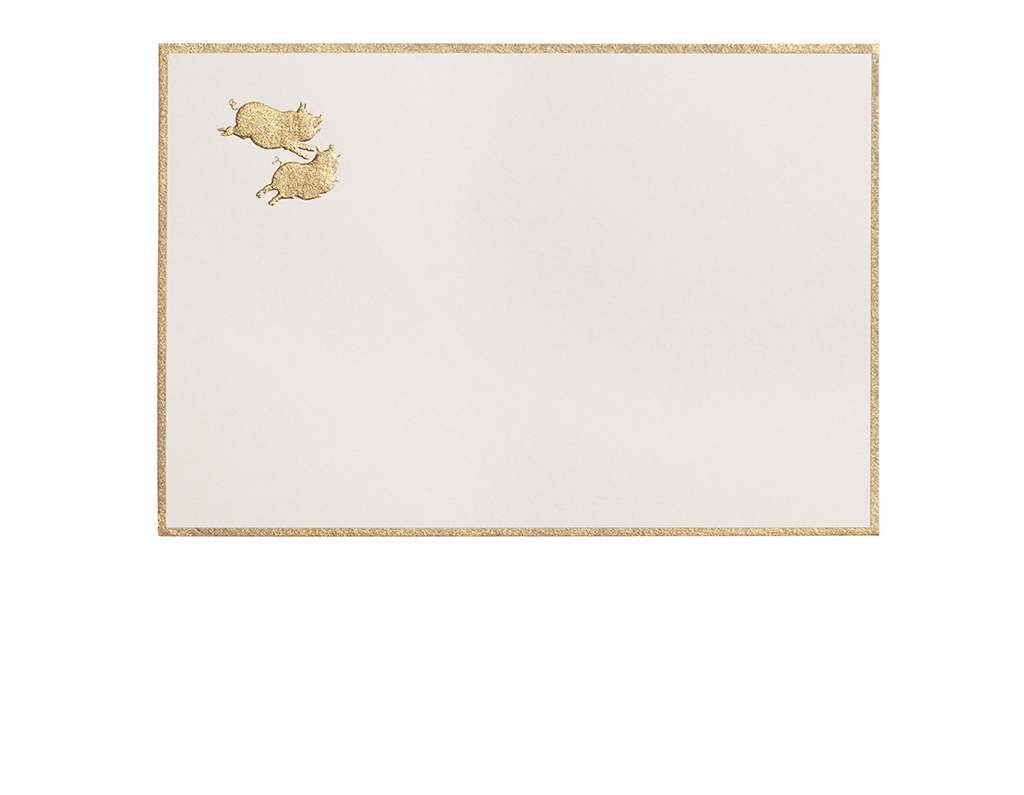 Two gold-embossed pigs leap across a blank, cream-colored card with a gold border.